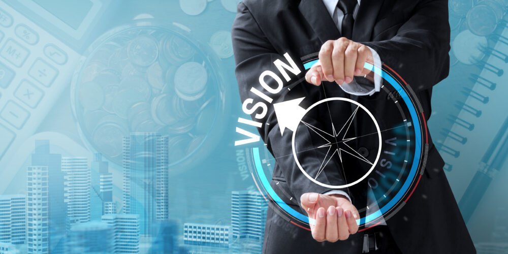 business man drive compass for vision